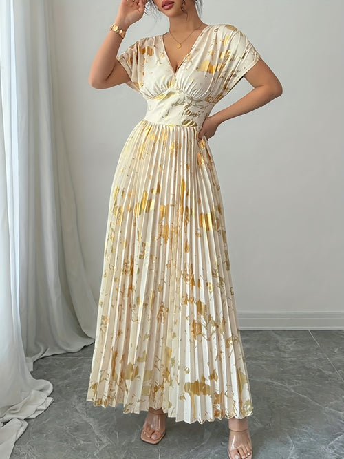 A Long Dress in Champagne Color, Featuring an Elegant And Refined Deep V-Neck, Drop Shoulders, a Cinched Waist, And Pleated A-Line Hem, Made from Gold-Printed Fabric, Perfect for Dates, Parties, And Everyday Fashion - SalmanStore 